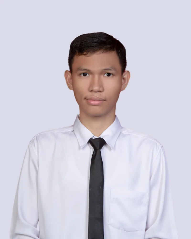 Portrait of M. Fazri Nizar in a white shirt and black tie
